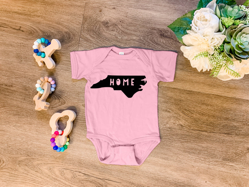 Home NC Pink Onesie | 12 Months Baby Moonlight Makers  Paper Skyscraper Gift Shop Charlotte